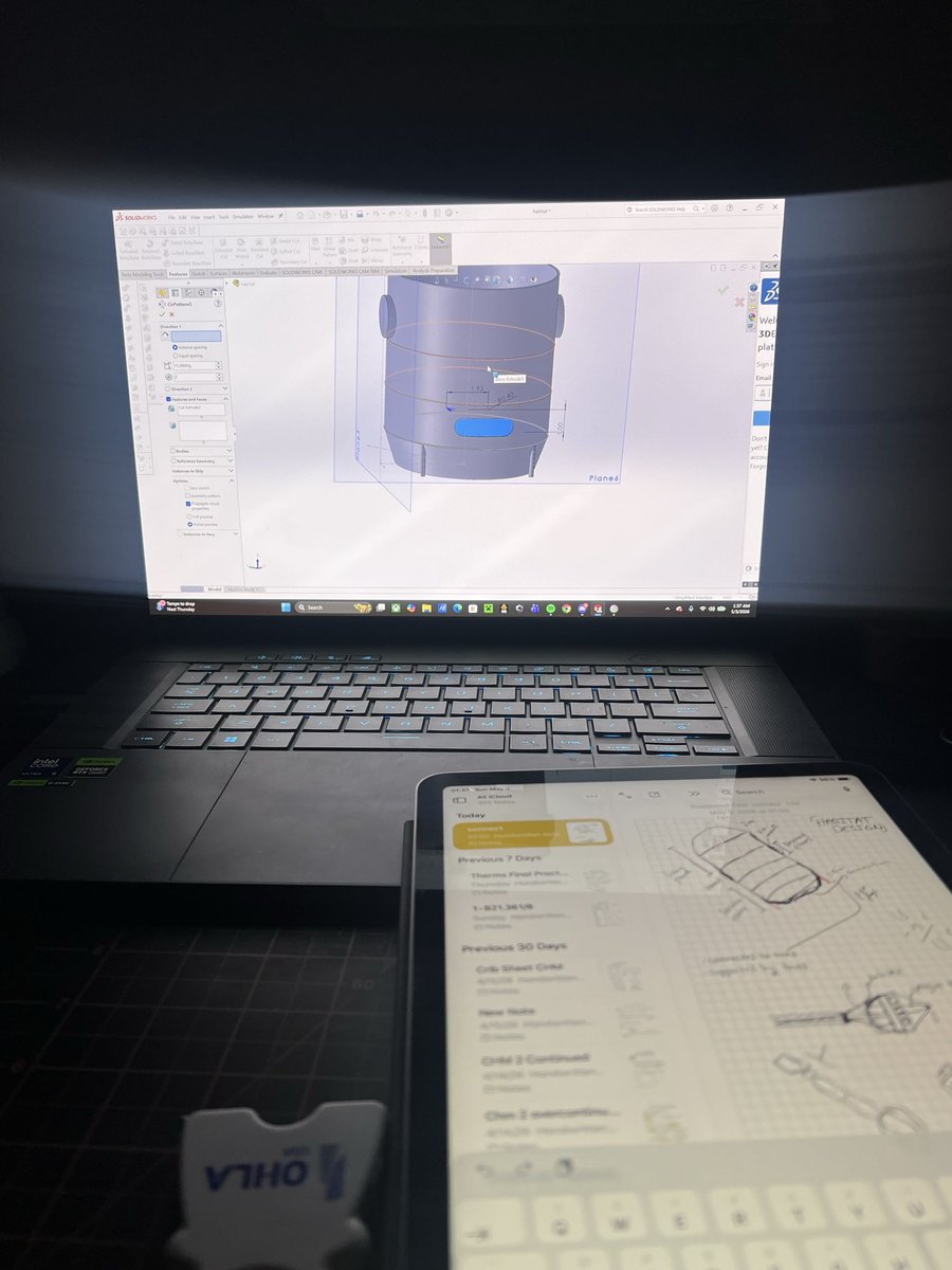 Laptop running SolidWorks on the habitat model beside an iPad sketch, 1:37 AM